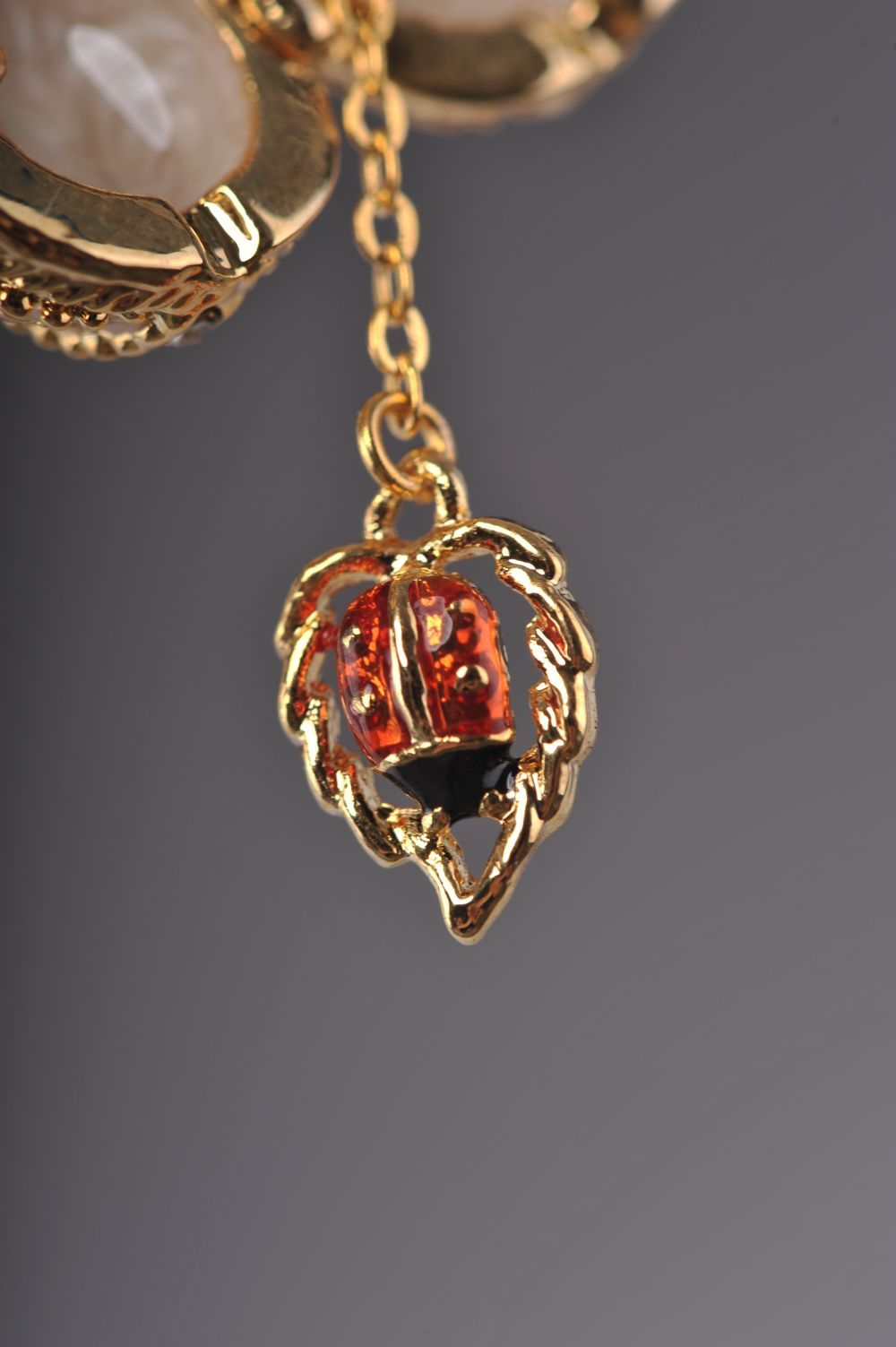 Keren Kopal Moccasin Egg Pendant with a Beetle