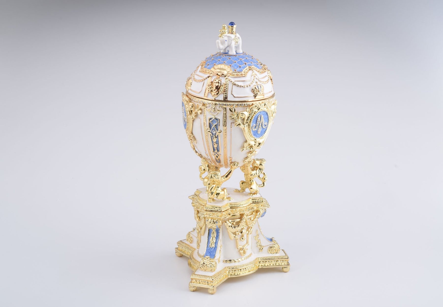 Keren Kopal White Faberge Egg with an Elephant on Top