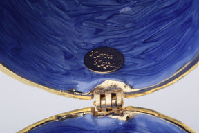 Oeuf de Fabergé bleu avec cristaux