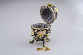 Oeuf de Fabergé noir décoré d'abeilles et de fleurs