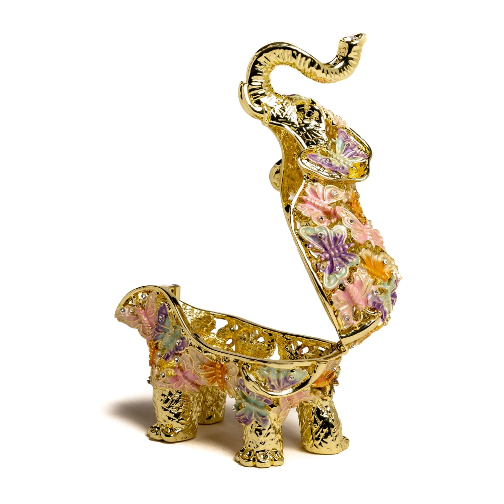 Eléphant doré décoré avec des papillons