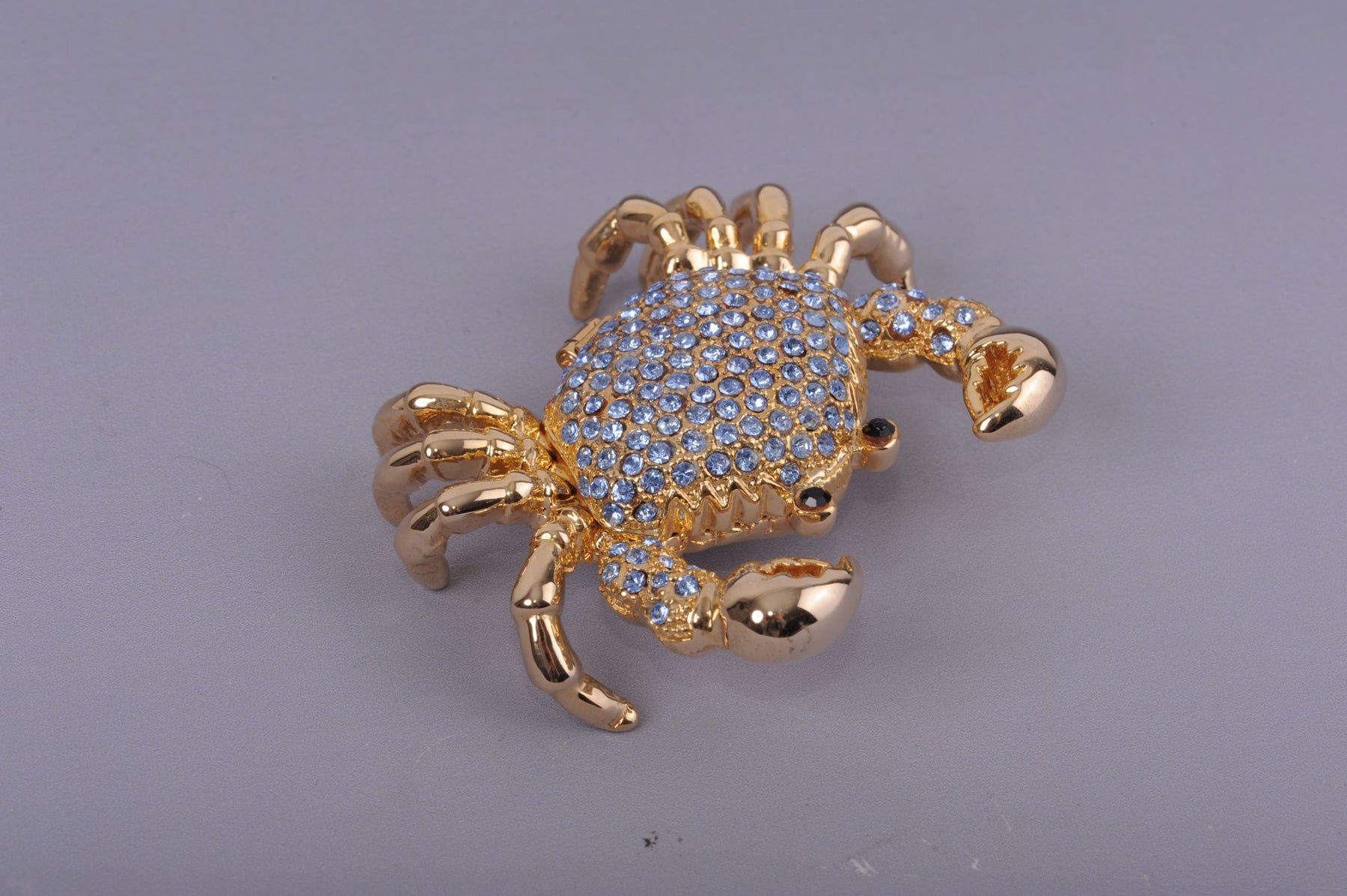 Golden Crab with blue stones