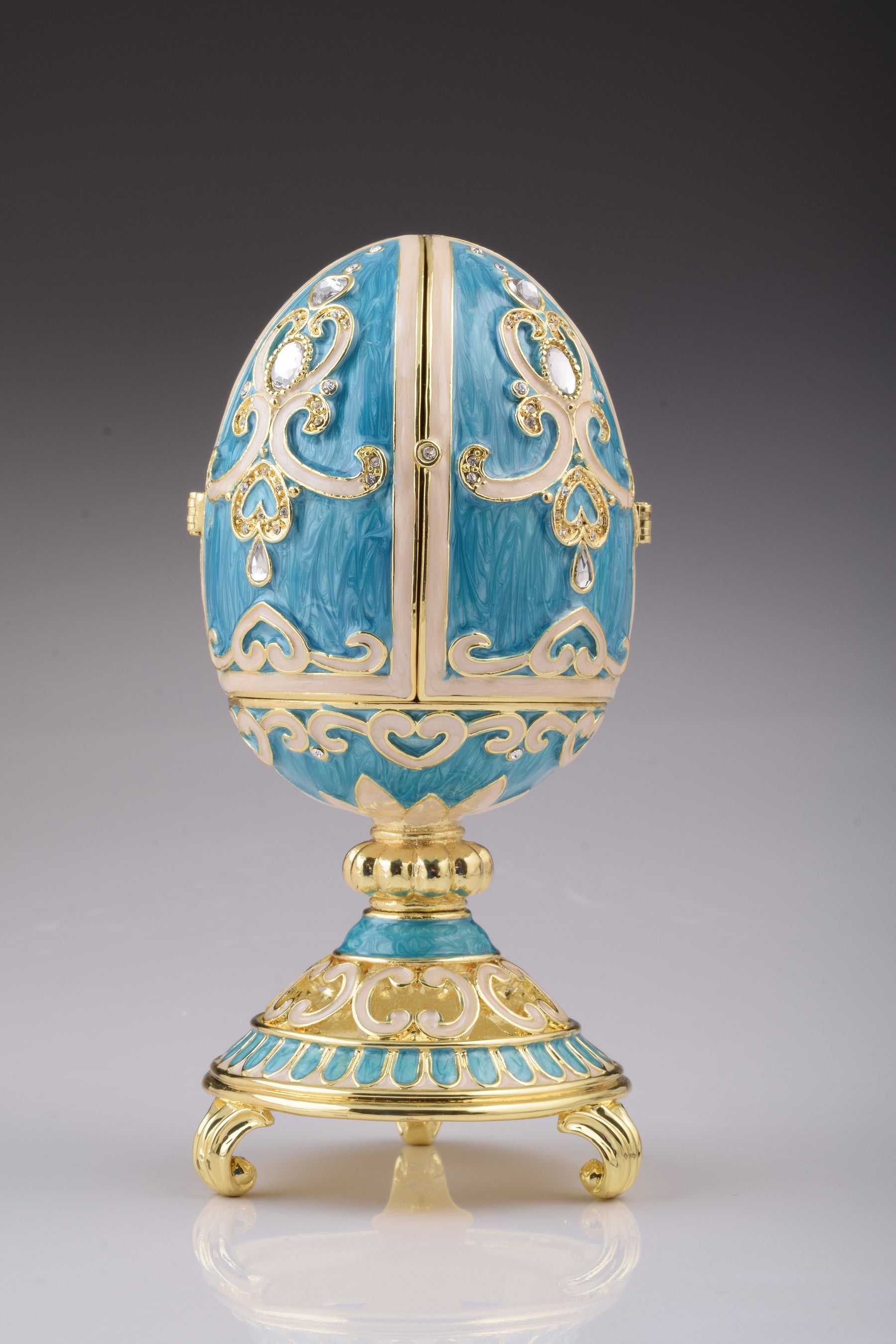 Blaugrünes Fabergé-Ei mit Uhr im Inneren