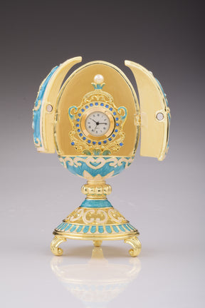 Oeuf Fabergé bleu sarcelle avec horloge à l'intérieur