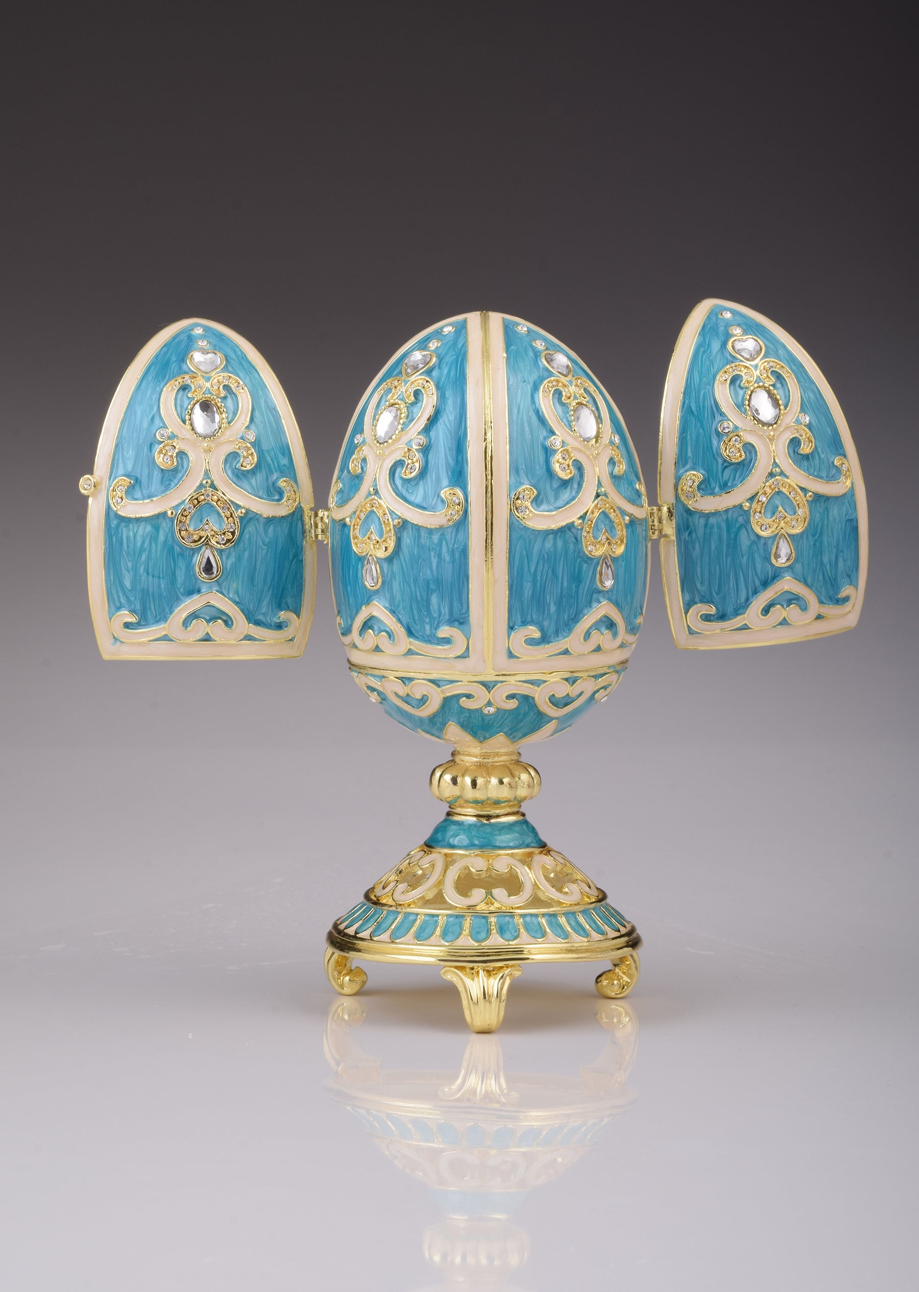 Blaugrünes Fabergé-Ei mit Uhr im Inneren