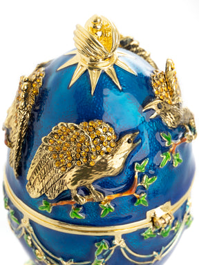 Blaues, musikspielendes russisches Ei mit Adlern